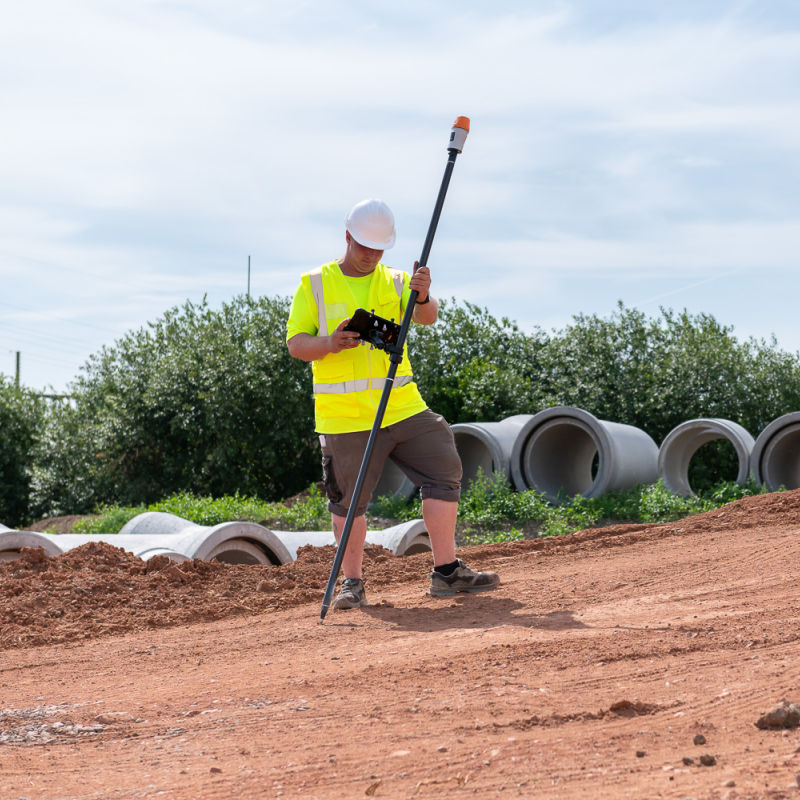 geo-FENNEL FGS 150-L Global Navigation Satellite System RTK Receiver on pole at a construction site 