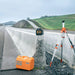 Geo Fennel FL 155 H-G Rotating Laser and case and tripod at a road construction site