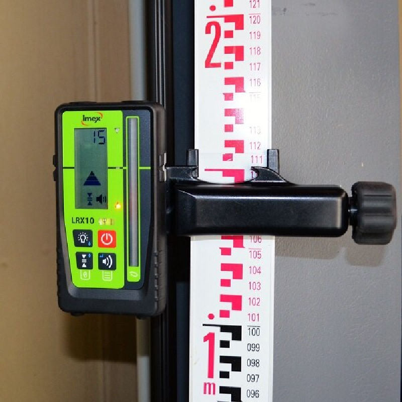 iMEX LRX 10 Laser Receiver attached to a leveling staff