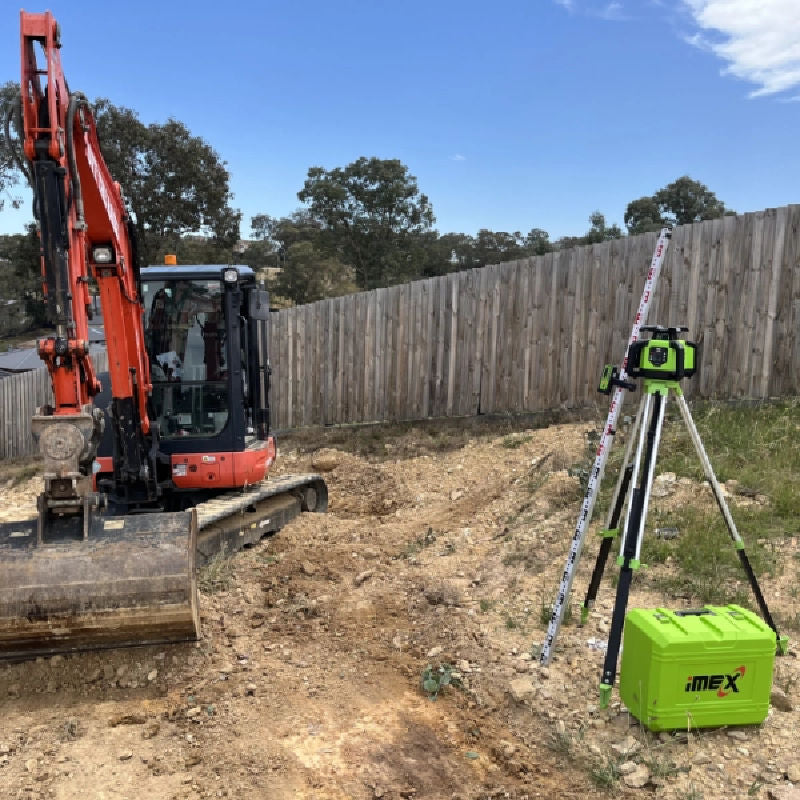 iMEX Z99R Dual Grade Red Beam Rotary Laser Level on a tripod with carry case